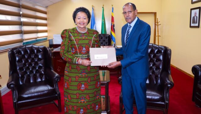 Minister of Foreign Affairs and International Cooperation Senator Pholile Shakantu receives the letter of appointment for Dr. Fekadu Fufa Dinssa as Country Representative for the World Vegetable Center in Eswatini, Thursday.